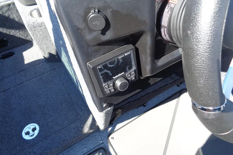Slide: The Image of Dashboard of 2026 Lund 1975 Tyee boat featuring control panel and steering wheel. - 22