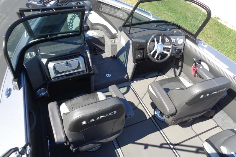 Slide: The Image of Interior of 2026 Lund 1975 Tyee boat with modern seating and steering console. - 24