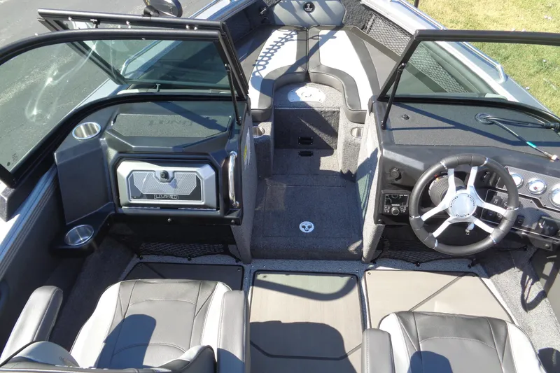 Slide: The Image of Interior of a 2026 Lund 1975 Tyee boat, featuring modern seating and steering wheel. - 25
