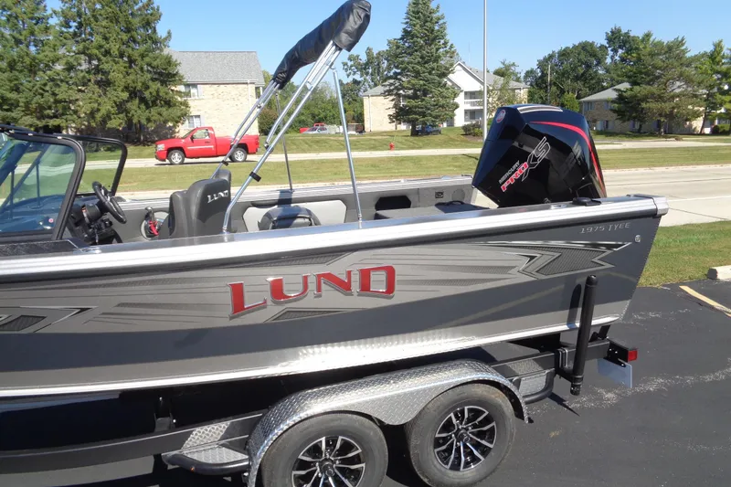 Slide: The Image of 2026 Lund 1975 Tyee boat with sleek design and powerful Mercury Pro XS engine. - 3
