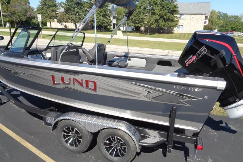 Slide: The Image of 2026 Lund 1975 Tyee boat with Mercury Pro XS engine on trailer. - 4
