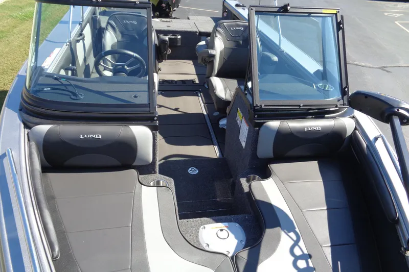 Slide: The Image of 2026 Lund 1975 Tyee boat interior with seating and steering wheel. - 9