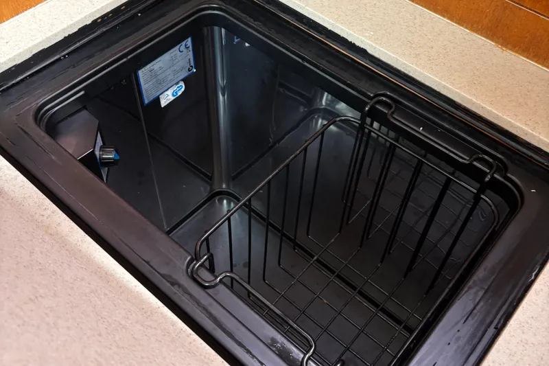 Slide: The Image of Built-in cooler compartment in 2006 Hunter 33 yacht kitchen area. - 18