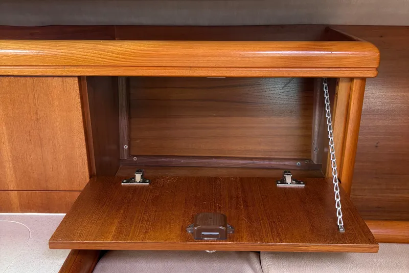 Slide: The Image of Wooden storage compartment in a 2006 Hunter 33 sailboat interior. - 21