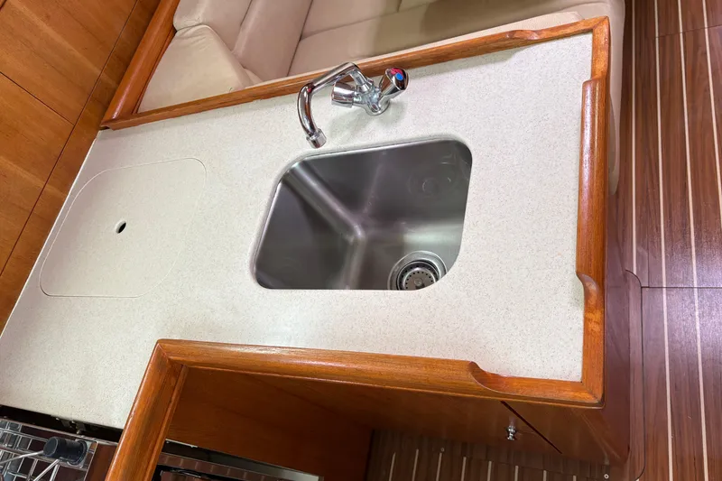 Slide: The Image of Hunter 33 yacht kitchen sink with wooden countertop, 2006 model. - 22