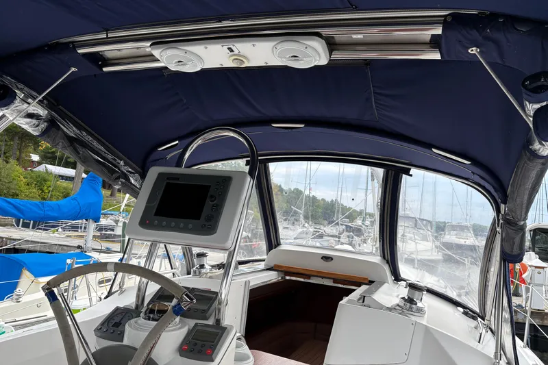 Slide: The Image of Interior view of a 2006 Hunter 33 sailboat cockpit with navigation equipment. - 3