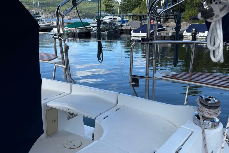 Slide: The Image of Hunter 33 sailboat cockpit, 2006 model, docked at a serene marina. - 9