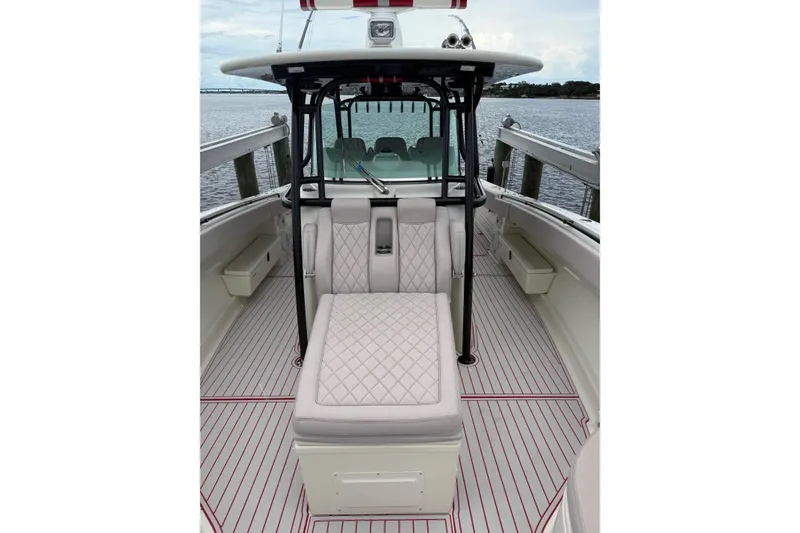 Slide: The Image of 2013 Hydra-Sports 42 boat interior with cushioned seating and sleek design. - 12