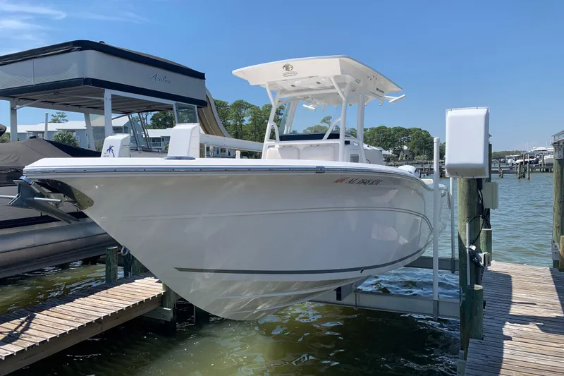 Slide: The Image of 2019 Sea Fox 266 Commander boat docked on a lift in a marina. - 1