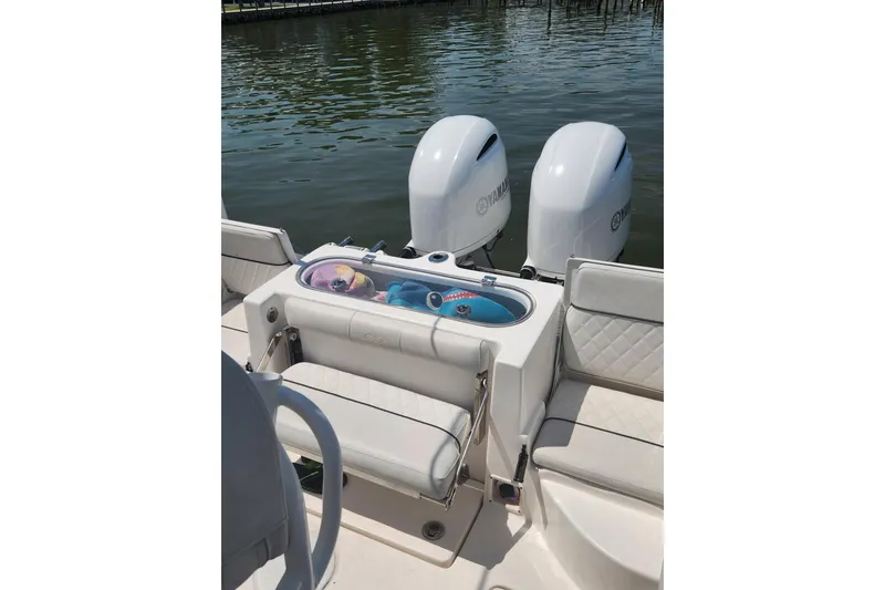 Slide: The Image of 2019 Sea Fox 266 Commander boat with dual Yamaha engines and seating area. - 11