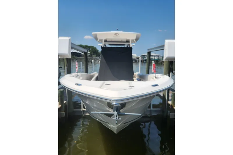 Slide: The Image of 2019 Sea Fox 266 Commander boat docked on a sunny day. - 2