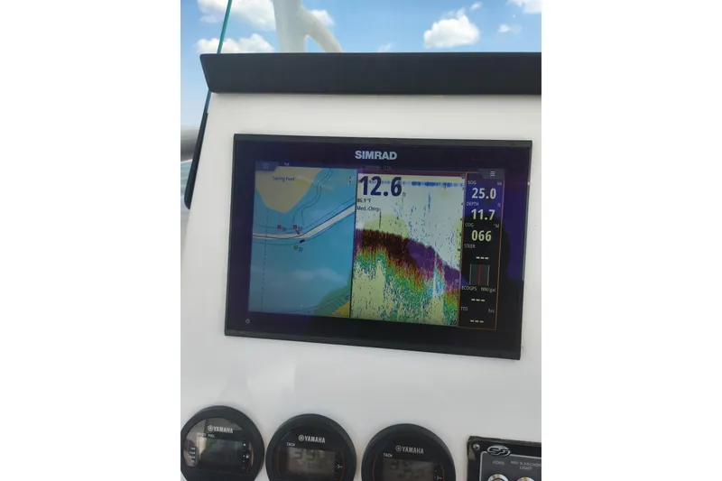 Slide: The Image of Simrad display on 2019 Sea Fox 266 Commander boat, showing navigation and sonar data. - 6