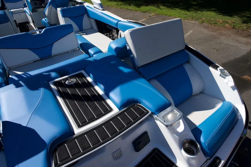 Slide: The Image of 2017 MasterCraft X26 boat interior with blue and white seating. - 20