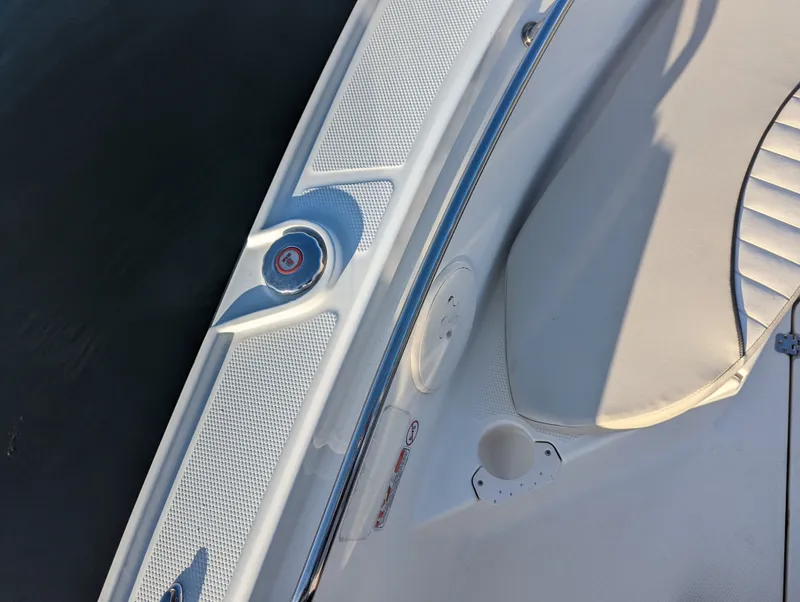 Slide: The Image of 2017 Mako 204 Center Console boat deck with seating and cup holder. - 18