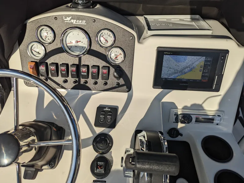 Slide: The Image of Center console of 2017 Mako 204 boat with gauges and Garmin GPS display. - 6
