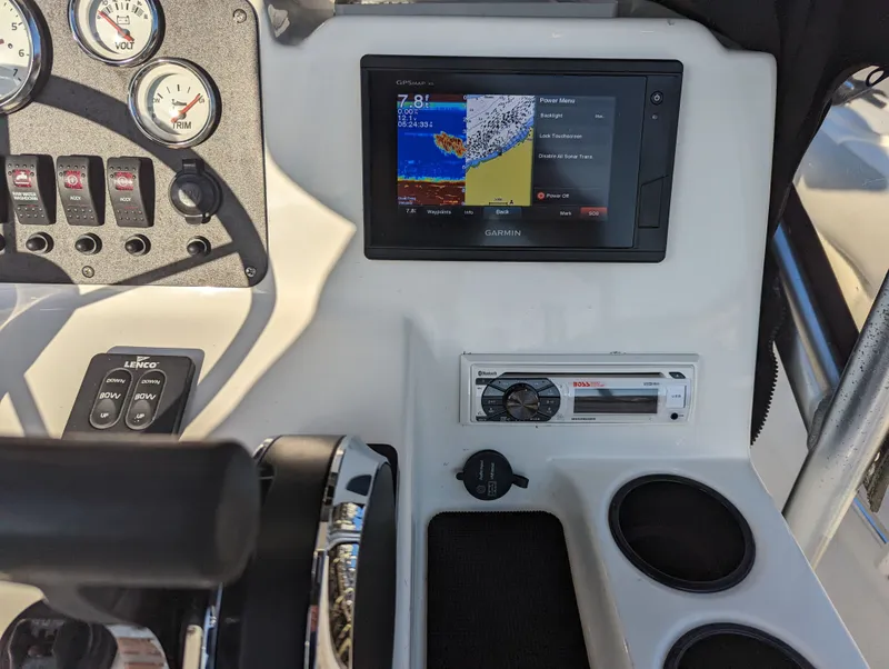 Slide: The Image of Center console of 2017 Mako 204 boat with Garmin GPS and Boss audio system. - 7