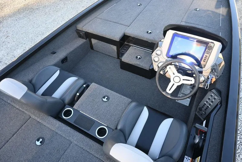 Slide: The Image of 2022 Vexus AVX1980 boat interior with steering wheel, seats, and control panel. - 2