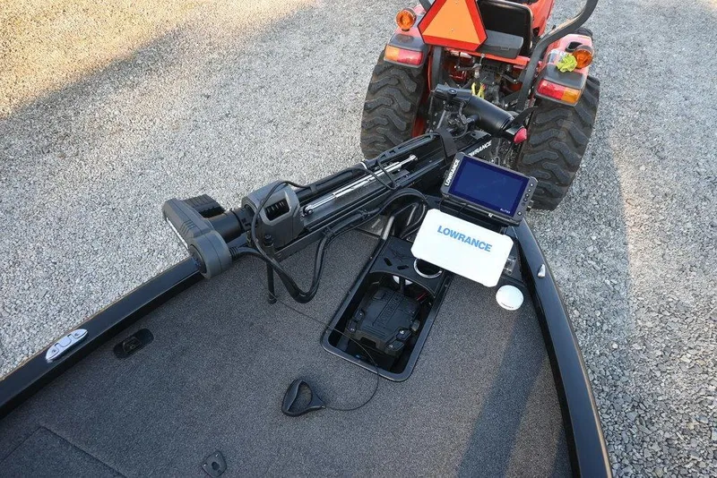 Slide: The Image of 2022 Vexus AVX1980 boat with Lowrance electronics and a tractor in the background. - 6