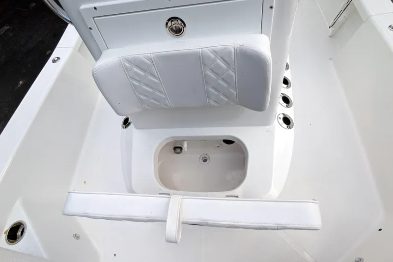 Slide: The Image of White K2 cooler on BlackJack 224 boat, 2026 model, secured under metal frame. - 17