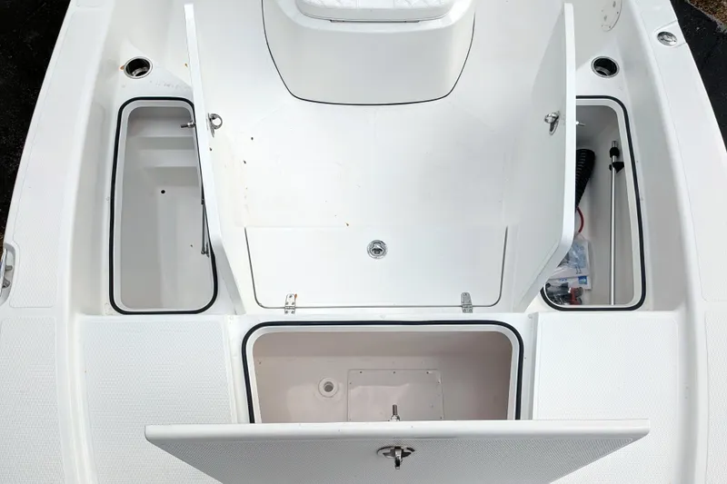 Slide: The Image of Open storage compartment on 2026 BlackJack 224 boat, featuring organized interior space. - 20