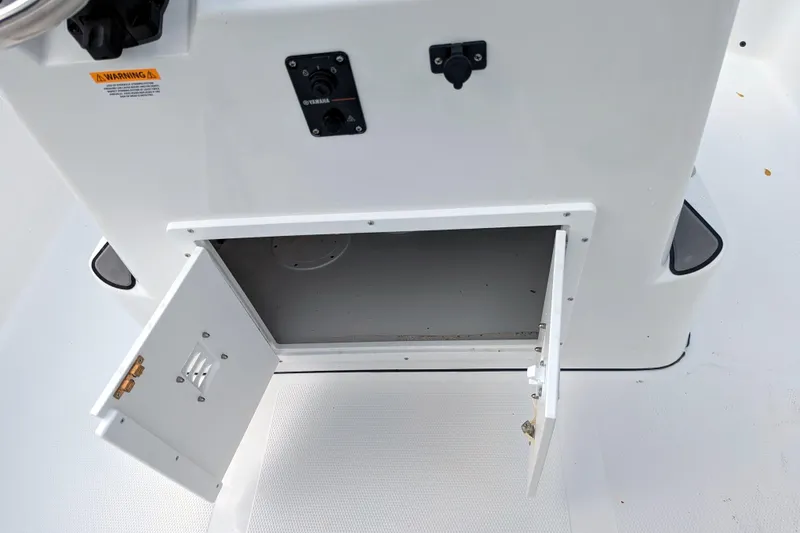 Slide: The Image of Open storage compartment on 2026 BlackJack 224 boat, showcasing interior design and functionality. - 27