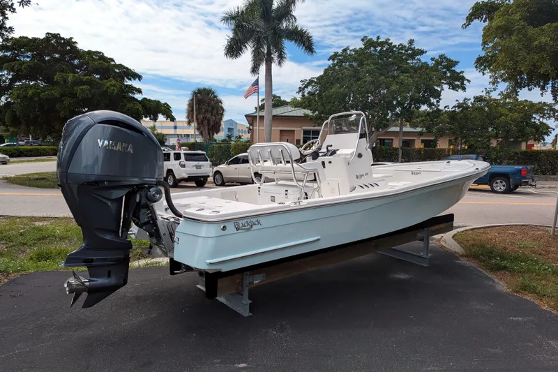 Slide: The Image of 2026 BlackJack 224 boat with Yamaha engine on display outdoors. - 5