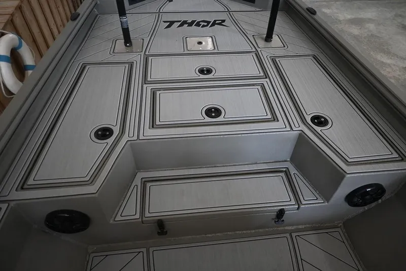 Slide: The Image of 2026 Thor Lake Hammer 1900CC boat deck with sleek design and storage compartments. - 7