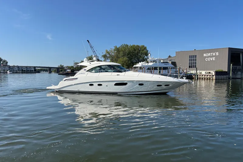 Slide: The Image of 2012 Sea Ray 470 Sundancer yacht cruising near North's Cove marina. - 0