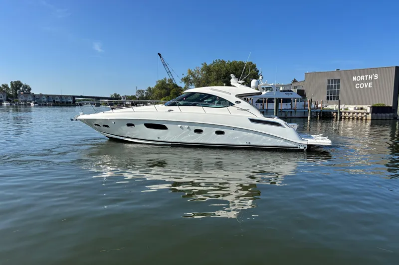 Slide: The Image of 2012 Sea Ray 470 Sundancer yacht docked at North's Cove marina. - 1