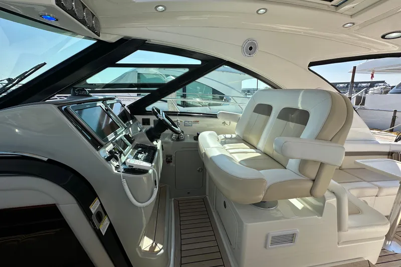 Slide: The Image of Luxurious interior of 2012 Sea Ray 470 Sundancer yacht with modern helm and seating. - 15