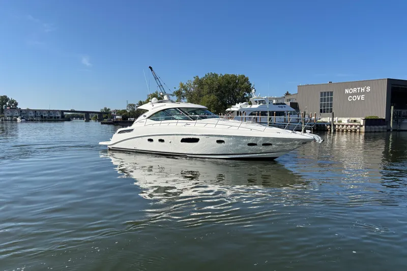 Slide: The Image of 2012 Sea Ray 470 Sundancer yacht docked at North's Cove marina. - 2
