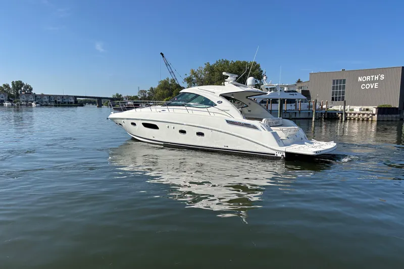 Slide: The Image of 2012 Sea Ray 470 Sundancer yacht cruising near North's Cove marina. - 3