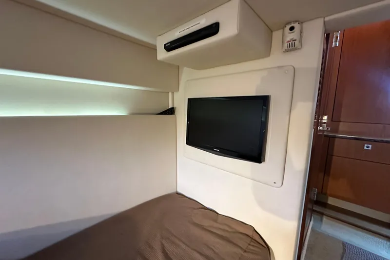 Slide: The Image of Interior cabin of 2012 Sea Ray 470 Sundancer with wall-mounted TV. - 30