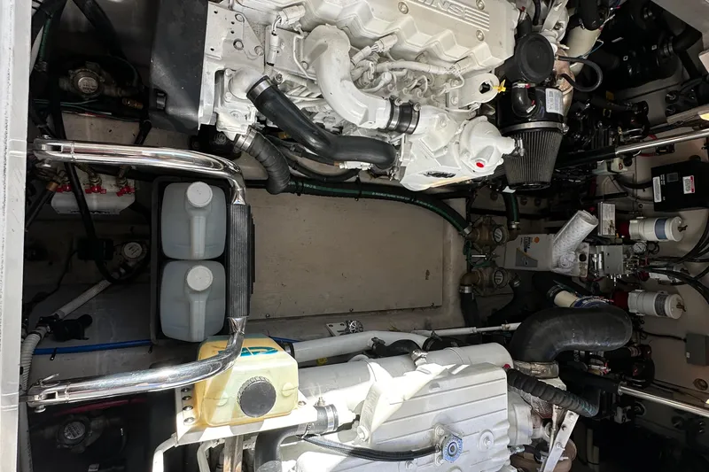 Slide: The Image of Engine room of 2012 Sea Ray 470 Sundancer, showcasing mechanical components and systems. - 33