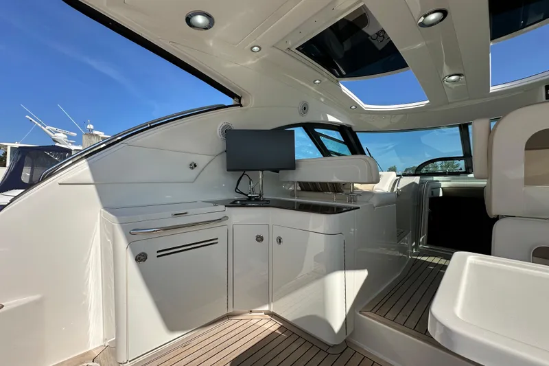 Slide: The Image of Luxurious interior of 2012 Sea Ray 470 Sundancer yacht with modern amenities and sleek design. - 9