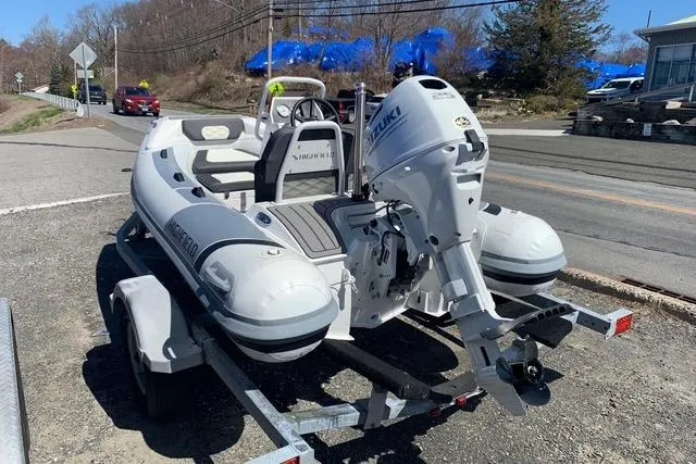Slide: The Image of 2023 Highfield Sport 330 inflatable boat on trailer with Suzuki outboard motor. - 11