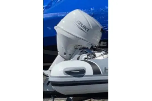 Slide: The Image of 2023 Highfield Sport 330 boat with Suzuki outboard motor, side view. - 4