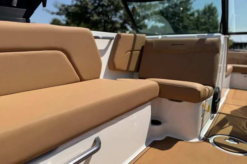 Slide: The Image of 2021 MasterCraft NXT24 boat interior with tan seating and sleek design. - 23