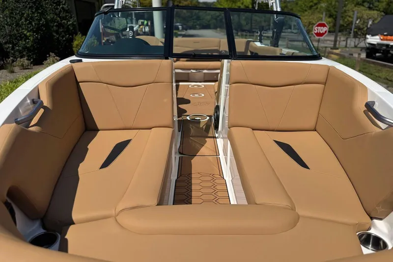 Slide: The Image of 2021 MasterCraft NXT24 boat interior with tan seating and modern design. - 25