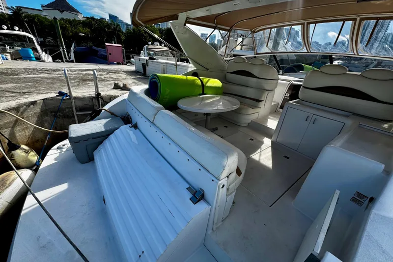 Slide: The Image of Trojan 440 Express 2000 yacht interior with seating and table at marina. - 18