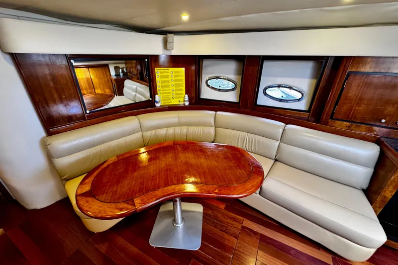 Slide: The Image of Luxurious interior of 2000 Trojan 440 Express yacht with elegant wood and leather seating. - 22