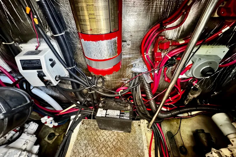 Slide: The Image of Engine room of a 2000 Trojan 440 Express with wiring and equipment. - 33