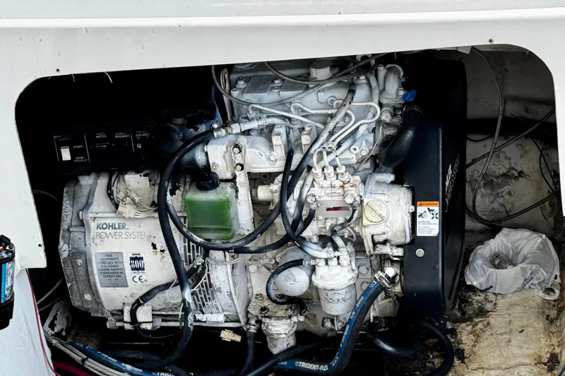 Slide: The Image of Engine compartment of a 2000 Trojan 440 Express boat with Kohler power system. - 36