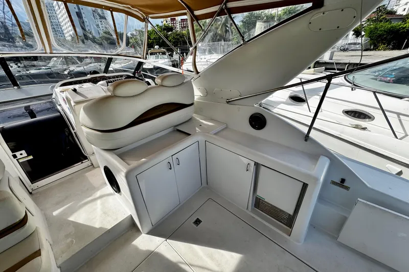 Slide: The Image of Interior of 2000 Trojan 440 Express yacht with seating and storage compartments. - 6