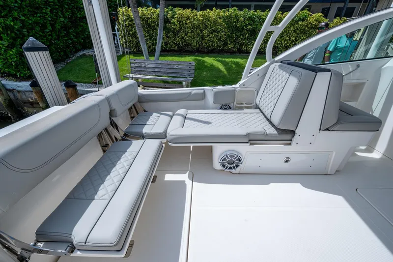 Slide: The Image of 2022 Pursuit DC 246 Dual Console boat interior with luxurious seating and modern design. - 17