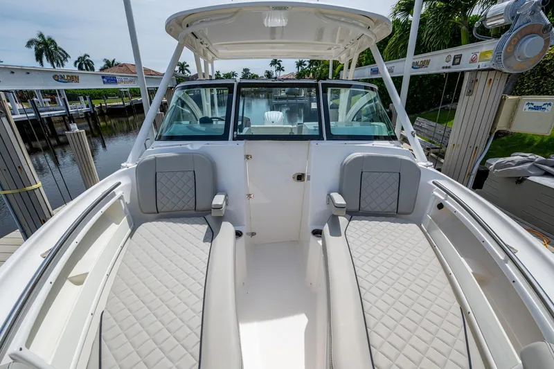 Slide: The Image of 2022 Pursuit DC 246 Dual Console boat with spacious seating and sleek design. - 26
