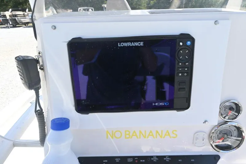 Slide: The Image of Avid 21 Mag 2025 boat dashboard with Lowrance HDS10 display and "No Bananas" text. - 11