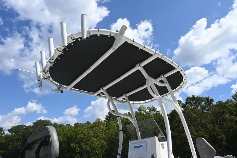 Slide: The Image of Avid 21 Mag 2025 boat with T-top against a blue sky and clouds. - 4