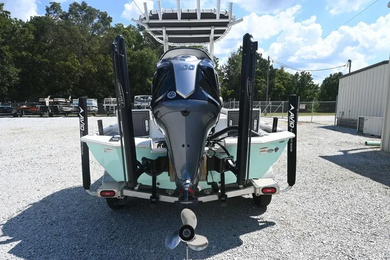 Slide: The Image of Avid 21 Mag 2025 boat with powerful outboard motor in a sunny outdoor setting. - 5