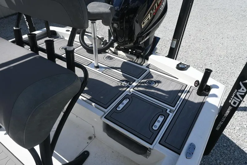 Slide: The Image of Avid 21 Mag 2025 boat interior with seating and storage compartments. - 6